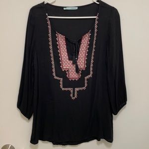 Black tunic, ties, pink&white stitching, sequins.